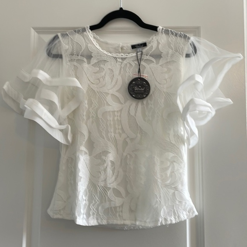 Women’s lace blouse with sheer flutter detail